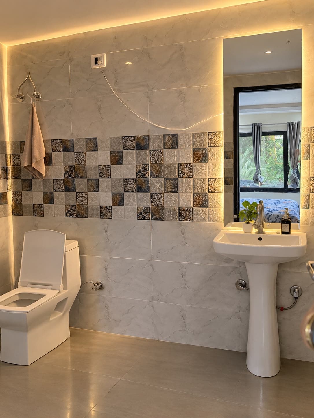 Clean attached washroom with mirror lighting